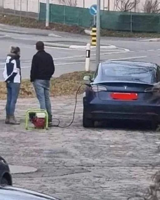 May be an image of 2 people, car and outdoors